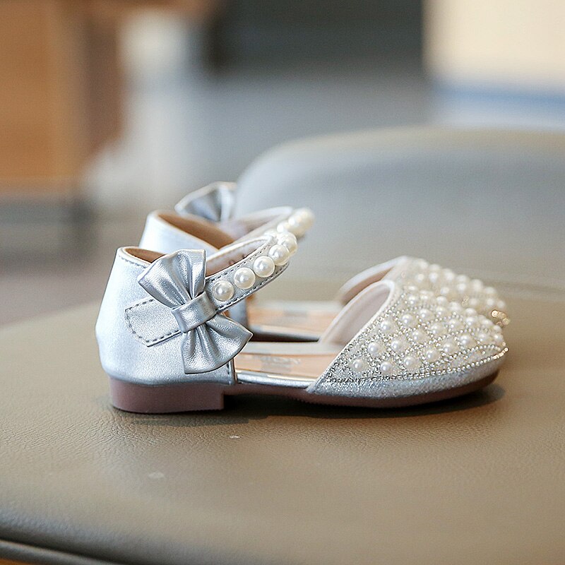 Pearl covered flat shoes in silver